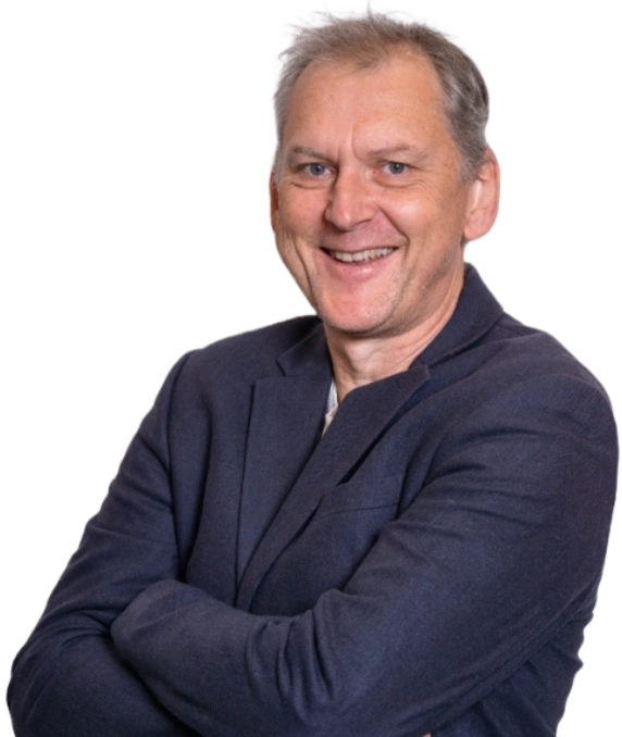 Managing Director Andy with arms folded looking to camera